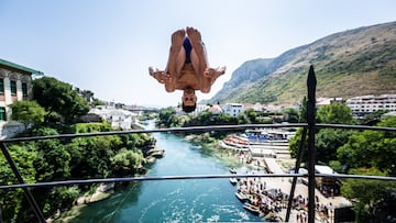 MOSTAR, BOSNIA AND HERZEGOVINA - AUGUST 25: (EDITORIAL USE ONLY) In this handout image provided by Red Bull, Jonathan Paredes of Mexico dives from the 21 metre Stari Most (Old Bridge) during the first competition day of the fifth stop of the Red Bull Cliff Diving World Series on August 25, 2022 in Mostar, Bosnia and Herzegovina. (Photo by Romina Amato/Red Bull via Getty Images)