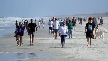 JACKSONVILLE BEACH, FLORIDA - APRIL 17: People are seen at the beach on April 17, 2020 in Jacksonville Beach, Florida. Jacksonville Mayor Lenny Curry announced Thursday that Duval County's beaches would open at 5 p.m. but only for restricted hours and can only be used for swimming, running, surfing, walking, biking, fishing, and taking care of pets. Sam Greenwood/Getty Images/AFP
== FOR NEWSPAPERS, INTERNET, TELCOS & TELEVISION USE ONLY ==