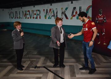 Mohamed Salah of Liverpool surprising school children for a 'Kop Kids' episode at Anfield, Liverpool, England.