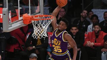 Feb 17, 2018; Los Angeles, CA, USA; Utah Jazz guard Donovan Mitchell (45) dunks over children and American actor Kevin Hart in the slam dunk contest during the 2018 All Star Saturday Night at Staples Center. Mandatory Credit: Richard Mackson-USA TODAY Sports