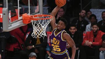 Feb 17, 2018; Los Angeles, CA, USA;  Utah Jazz guard Donovan Mitchell (45) dunks over children and American actor Kevin Hart in the slam dunk contest during the 2018 All Star Saturday Night at Staples Center. Mandatory Credit: Richard Mackson-USA TODAY Sports