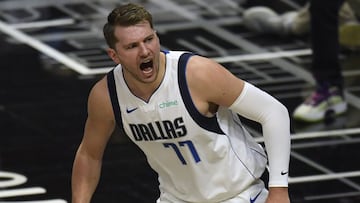 LOS ANGELES, CALIFORNIA - MAY 25: Luka Doncic #77 of the Dallas Mavericks reacts after his dunk against the LA Clippers in the first quarter during game two of the Western Conference first round series at Staples Center on May 25, 2021 in Los Angeles, California.   Harry How/Getty Images/AFP NOTE TO USER: User expressly acknowledges and agrees that, by downloading and or using this photograph, User is consenting to the terms and conditions of the Getty Images License Agreement.
 == FOR NEWSPAPERS, INTERNET, TELCOS &amp; TELEVISION USE ONLY ==