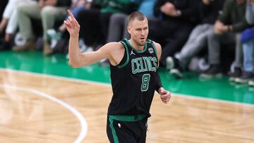 BOSTON, MASSACHUSETTS - JUNE 09: Kristaps Porzingis #8 of the Boston Celtics reacts during the first quarter against the Dallas Mavericks in Game Two of the 2024 NBA Finals at TD Garden on June 09, 2024 in Boston, Massachusetts. NOTE TO USER: User expressly acknowledges and agrees that, by downloading and or using this photograph, User is consenting to the terms and conditions of the Getty Images License Agreement.   Adam Glanzman/Getty Images/AFP (Photo by Adam Glanzman / GETTY IMAGES NORTH AMERICA / Getty Images via AFP)