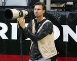 Why is Randy Johnson working the NFL sidelines as a photographer?
