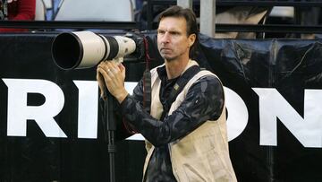 The row of photographers at the back of the end zone in NFL games are not usually noticed by the public on an individual basis, but nobody could mistake the Big Unit behind the lens