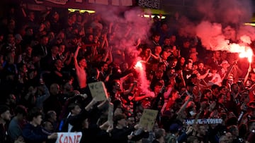 Metz' supporters light flares at the end of the French L1 football match between FC Metz and Paris Saint-Germain (PSG) at the Saint-Symphorien Stadium in Longeville-les-Metz, eastern France, on May 19, 2024. (Photo by Jean-Christophe VERHAEGEN / AFP)