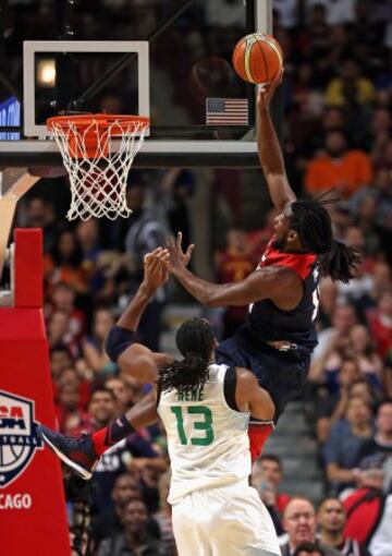 CHICAGO, IL - AUGUST 16: Kenneth Faried #18 of team USA puts up a shot over Nene Hilario #13 of team Brazil during an exhibition game at the United Center on August 16, 2014 in Chicago, Illinois.   Jonathan Daniel/Getty Images/AFP
== FOR NEWSPAPERS, INTERNET, TELCOS & TELEVISION USE ONLY ==