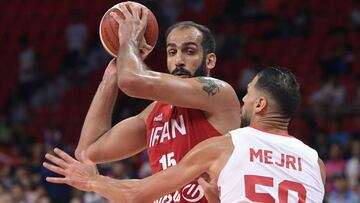 Tunisia&#039;s Salah Mejri (R) attempts to block Iran&#039;s Hamed Haddadi (L) during the Basketball World Cup Group C game between Tunisia and Iran in Guangzhou on September 2, 2019. (Photo by Nicolas ASFOURI / AFP)