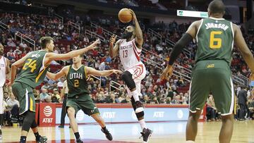 Nov 19, 2016; Houston, TX, USA; Houston Rockets guard James Harden (13) drives to the basket against Utah Jazz center Jeff Withey (24) and forward Joe Ingles (2) in the second half at Toyota Center. Rockets won 111-102. Mandatory Credit: Thomas B. Shea-USA TODAY Sports