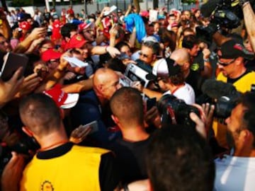 Fernando Alonso signs autographs