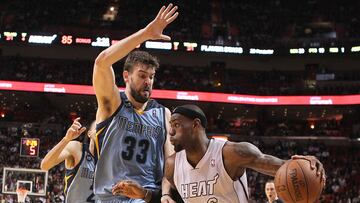 The Miami Heat's LeBron James drives against the Memphis Grizzlies' Marc Gasol during the fourth quarter at the AmericanAirlines Arena in Miami, Florida, on Friday, March 1, 2013.
