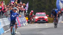 Movistar Team's Colombian rider Einer Rubio (L) celebrates as he arrives to cross the finish line, ahead of Groupama - FDJ's French rider Thibaut Pinot (Rear R) and EF Education-EasyPost's Ecuadorian rider Jefferson Alexander Cepeda (Rear C), to win the thirteenth stage of the Giro d'Italia 2023 cycling race, which start was transfered from Borgofranco d'Ivrea to Le Chable in Switzerland due to bad weather conditions, and Crans-Montana, on May 19, 2023. (Photo by Luca Bettini / AFP)