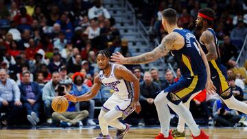 Feb 5, 2023; New Orleans, Louisiana, USA; Sacramento Kings guard Davion Mitchell (15) looks to pass against New Orleans Pelicans center Willy Hernangomez (9) during the second quarter at Smoothie King Center. Mandatory Credit: Andrew Wevers-USA TODAY Sports