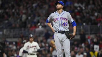 New York Mets' Jacob deGrom (48) takes a deep breath after walking Atlanta Braves Freddie Freeman, left, during the third inning of a baseball game Sunday, April 14, 2019, in Atlanta. (AP Photo/John Amis)