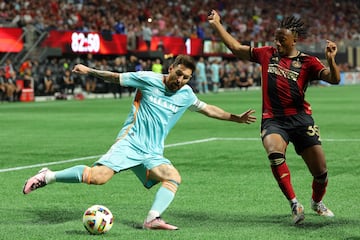 Lionel Messi #10 of Inter Miami attempts to cross the ball against Ajani Fortune #35 of Atlanta United 