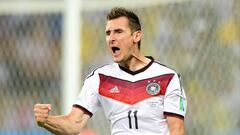 (FILE) A photo taken on June  21, 2014 shows Germany's forward Miroslav Klose celebrats after scoring during a Group G football match between Germany and Ghana at the Castelao Stadium in Fortaleza during the 2014 FIFA World Cup . Klose, the all-time World Cup top scorer, has retired from international football, the German football federation announced on August 11, 2014.
AFP PHOTO / JAVIER SORIANO