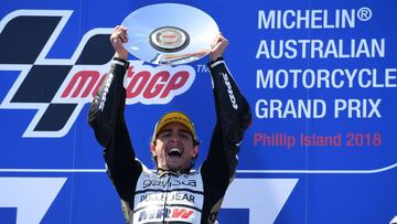 KTM Angel Nieto Team Moto3 Spanish rider Albert Arenas celebrates his victory on podium of the Australian Grand Prix Moto3 race at Phillip Island on October 28, 2018, ahead of the MotoGP Australian Grand Prix. (Photo by WILLIAM WEST / AFP) / -- IMAGE REST