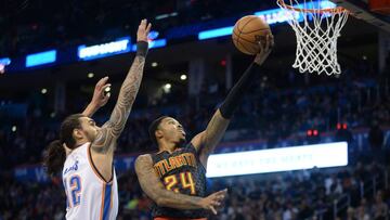 Dec 19, 2016; Oklahoma City, OK, USA; Atlanta Hawks forward Kent Bazemore (24) drives to the basket in front of Oklahoma City Thunder center Steven Adams (12) during the fourth quarter at Chesapeake Energy Arena. Mandatory Credit: Mark D. Smith-USA TODAY Sports