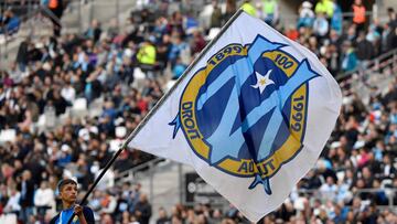 (FILES) In this file photo taken on February 22, 2020 shows Olympique Marseille's flag with the logo is waved during the French L1 football match between Olympique de Marseille (OM) and Football Club de Nantes (FCN) at the Velodrome Stadium in Marsei