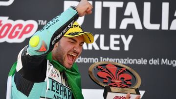 Leopard Racing's Italian rider Dennis Foggia celebrates on podium winning the Moto3 race of the Italian Moto GP Grand Prix at the Mugello race track in Scarperia e San Piero on May 30, 2021. (Photo by Tiziana FABI / AFP)
