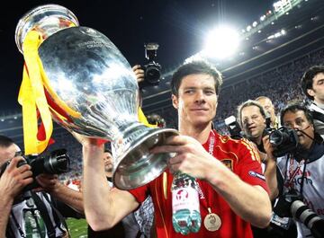 He's won stuff | Spanish midfielder Xabi Alonso holds up the Trophy after Spain won the Euro 2008 championships.