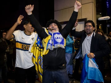 Boca Juniors fans await the team's arrival in Madrid.