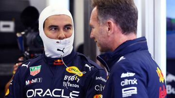 BUDAPEST, HUNGARY - JULY 31: Sergio Perez of Mexico and Oracle Red Bull Racing talks with Red Bull Racing Team Principal Christian Horner in the garage ahead of the F1 Grand Prix of Hungary at Hungaroring on July 31, 2022 in Budapest, Hungary. (Photo by Mark Thompson/Getty Images)