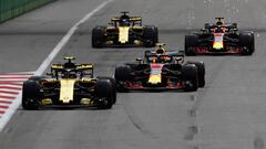 BAKU, AZERBAIJAN - APRIL 29:  Carlos Sainz of Spain driving the (55) Renault Sport Formula One Team RS18 leads Max Verstappen of the Netherlands driving the (33) Aston Martin Red Bull Racing RB14 TAG Heuer on track during the Azerbaijan Formula One Grand 