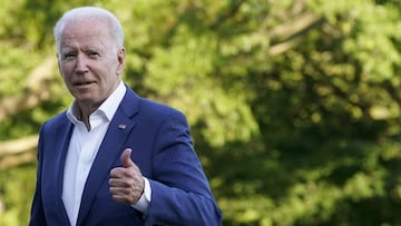 President Joe Biden gestures as he walks on the South Lawn of the White House after stepping off Marine One, Sunday, June 27, 2021, in Washington. Biden is returning from a weekend at Camp David. (AP Photo/Patrick Semansky)