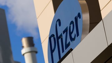 (FILES) In this file photo taken on March 18, 2017, a sign for Pfizer pharmaceutical company is seen on a building in Cambridge, Massachusetts. - A vaccine jointly developed by Pfizer and BioNTech was 90 percent effective in preventing Covid-19 infections