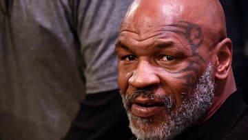 (FILES) In this file photo taken on November 05, 2021, former boxing heavyweight champion Mike Tyson attends the weigh-in for boxers Canelo Alvarez and Caleb Plant in Las Vegas, Nevada. - Tyson repeatedly punched a passenger on a plane about to fly out of San Francisco after reportedly becoming irritated by the man's attempts to talk to him. Cell phone footage showed Tyson leaning over the back of his seat and delivering a flurry of blows to the man, who appeared to be left with bruises and some bleeding in the incident on April 20, 2022. (Photo by Patrick T. FALLON / AFP)