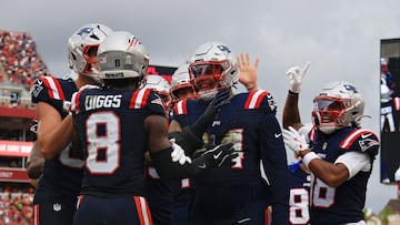 TAMPA, FLORIDA - NOVEMBER 09: Stefon Diggs #8 of the New England Patriots is congratulated by his teammates after a touchdown reception against the Tampa Bay Buccaneers during the first half during the first half in the game at Raymond James Stadium on November 09, 2025 in Tampa, Florida. Mike Ehrmann/Getty Images/AFP (Photo by Mike Ehrmann / GETTY IMAGES NORTH AMERICA / Getty Images via AFP)