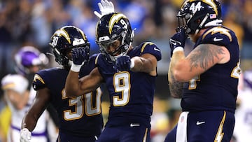 INGLEWOOD, CALIFORNIA - OCTOBER 23: Tre' Harris #9 of the Los Angeles Chargers celebrates with Kimani Vidal #30 and Scott Matlock #44 after scoring a 6 yard touchdown against the Minnesota Vikings during the fourth quarter in the game at SoFi Stadium on October 23, 2025 in Inglewood, California.   Luke Hales/Getty Images/AFP (Photo by Luke Hales / GETTY IMAGES NORTH AMERICA / Getty Images via AFP)