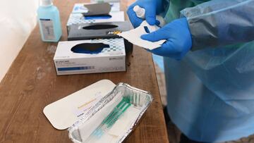 A doctor prepares doses containing AstraZeneca vaccine against the coronavirus (Covid-19) at a drive-in vaccination centre in Schwelm, western Germany, on April 7, 2021, amid the ongoing pandemic. - Because the appointments at the vaccination centre in th