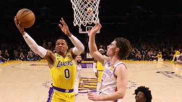 LOS ANGELES, CALIFORNIA - FEBRUARY 07: Russell Westbrook #0 of the Los Angeles Lakers scores past Josh Giddey #3 and Jalen Williams #8 of the Oklahoma City Thunder in a game in which LeBron James #6 passed Kareem Abdul-Jabbar to become the NBA's all-time leading scorer, surpassing Abdul-Jabbar's career total of 38,387 points against the Oklahoma City Thunder at Crypto.com Arena on February 07, 2023 in Los Angeles, California.   Harry How/Getty Images/AFP (Photo by Harry How / GETTY IMAGES NORTH AMERICA / Getty Images via AFP)