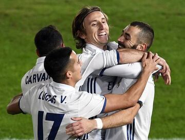 Benzema (right) celebrates with his Real Madrid team-mates after giving Los Merengues the lead during the Club World Cup final on Sunday.
