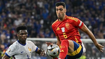 France's midfielder #08 Aurelien Tchouameni and Spain's midfielder #06 Mikel Merino fight for the ball during the UEFA Euro 2024 semi-final football match between Spain and France at the Munich Football Arena in Munich on July 9, 2024. (Photo by JAVIER SORIANO / AFP)