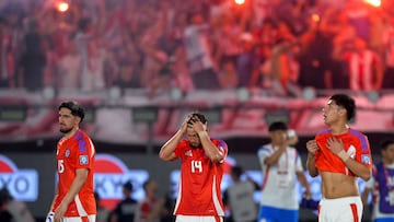 Chile's midfielder #15 Diego Valdes, defender #14 Felipe Loyola, and forward #16 Dario Osorio leave after losing during the 2026 FIFA World Cup South American qualifiers football match between Paraguay and Chile at the Defensores del Chaco stadium in Asuncion on March 20, 2025. (Photo by DANIEL DUARTE / AFP)