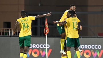South Africa's forward #09 Lyle Foster (R) celebrates scoring his team's second goal with South Africa's midfielder #13 Sphephelo Yaya Sithole (3rd R) and South Africa's defender #14 Mbekezeli Mbokazi (L) during the Africa Cup of Nations (CAN) Group B football match between South Africa and Angola at Marrakesh Stadium in Marrakesh, Morocco on December 22, 2025. (Photo by Khaled DESOUKI / AFP)