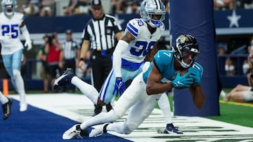 Aug 12, 2023; Arlington, Texas, USA; Jacksonville Jaguars wide receiver Zay Jones (7) makes a touchdown catch past Dallas Cowboys safety Sheldrick Redwine (36) during the first quarter at AT&T Stadium. Mandatory Credit: Kevin Jairaj-USA TODAY Sports