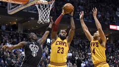 Dec 20, 2016; Milwaukee, WI, USA;  Cleveland Cavaliers forward LeBron James (23) grabs a rebound with help from forward Richard Jefferson (24) against Milwaukee Bucks guard Tony Snell (21) in overtime at BMO Harris Bradley Center. James scored 34 points to help the Cavaliers beat the Bucks 114-108. Mandatory Credit: Benny Sieu-USA TODAY Sports