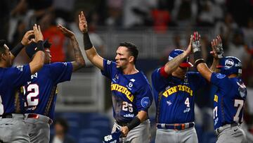 Venezuela's infielder #26 Hernan Alejandro Perez celebrates after scoring a run during the Caribbean Series baseball game between Venezuela and Mexico at LoanDepot Park in Miami, Florida, on February 5, 2024. (Photo by Chandan Khanna / AFP)