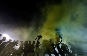 Boca players celebrate with the trophy after they clinched the Argentine tournament.