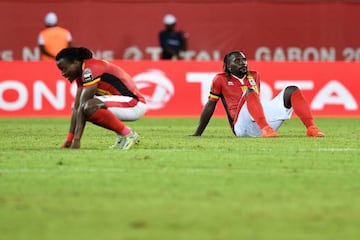Uganda's midfielder Hassan Wasswa and Uganda's midfielder Geoffrey Kizito react at the end of the Ghana game.