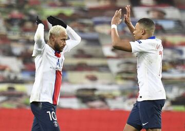 Kylian Mbappe (R) and Neymar (L) of PSG celebrate at the end of the UEFA Champions League group H match between Manchester United and PSG in Manchester, Britain, 02 December 2020.