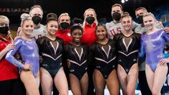 US gymnasts (fromL) Mykayla Skinner, Sunisa Lee, Simone Biles, Jordan Chiles, Grace McCallum and Jade Carey pose with team members after a training session at the Ariake Gymnastics Centre in Tokyo, on July 22.