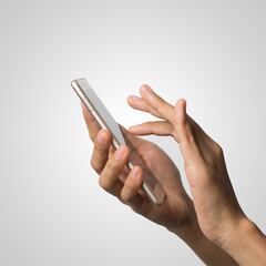 What does the green or orange dot on the top of your phone mean?