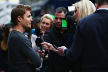 Reigning world champion Nico Rosberg, who retired at the end of last season, speaks to the media as he visits his former competitors on the F1 grid.