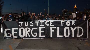 ATLANTA, GA - MARCH 08: Demonstrators hold a vigil in honor of George Floyd on March 8, 2021 in Atlanta, Georgia. Jury selection was paused today in the trial of former Minneapolis police officer Derek Chauvin, who is charged in Floyd&#039;s death.   Mega