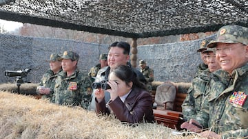 North Korean leader Kim Jong Un and his daughter Kim Ju Ae attend a demonstration during the training of the Korean People's Army's air and amphibious combat units in this picture released on March 16, 2024, by the Korean Central News Agency. KCNA via REUTERS ATTENTION EDITORS - THIS IMAGE WAS PROVIDED BY A THIRD PARTY. REUTERS IS UNABLE TO INDEPENDENTLY THIS IMAGE. NO THIRD PARTY SALES. SOUTH KOREA OUT. NO COMMERCIAL OR EDITORIAL SALES IN SOUTH KOREA.